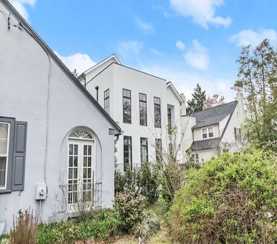 Luxury large white home with garden in front of home in Wesley Heights, Washington, DC.